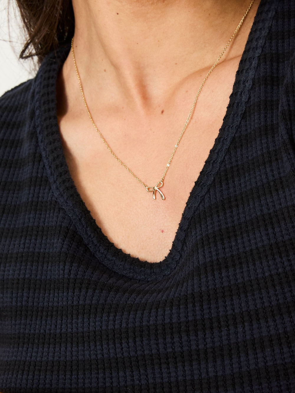 Gold Tone Bow Pendant Necklace